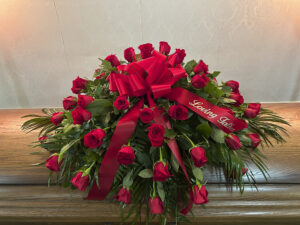 Ruby Remembrance – Casket Spray (All Red Roses)
