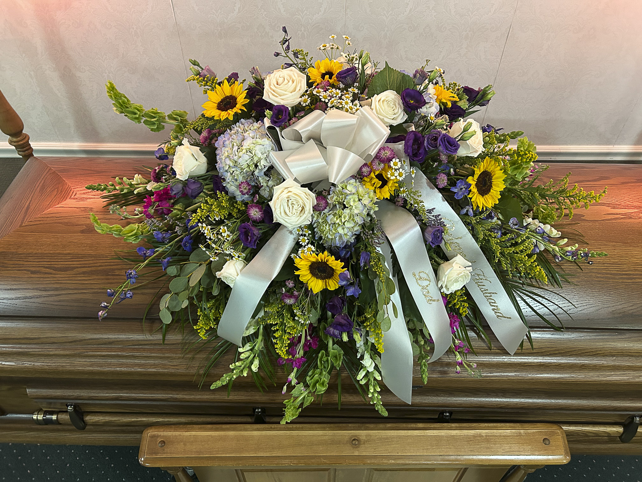 Casket Spray with White Roses and Sunflowers – “Meadows of Memories”
